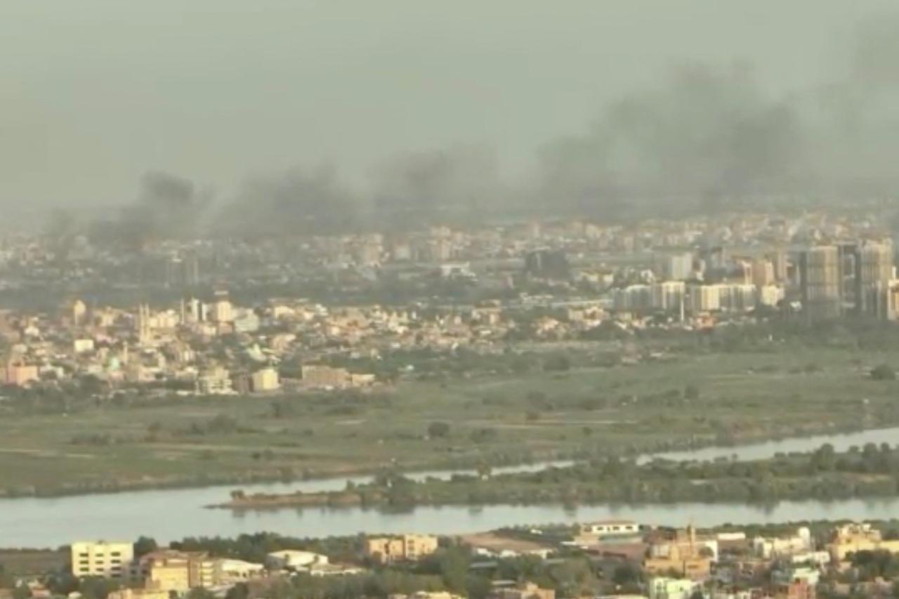 FILE PHOTO: Smoke rises over the city as army and paramilitaries clash in power struggle, in Khartoum