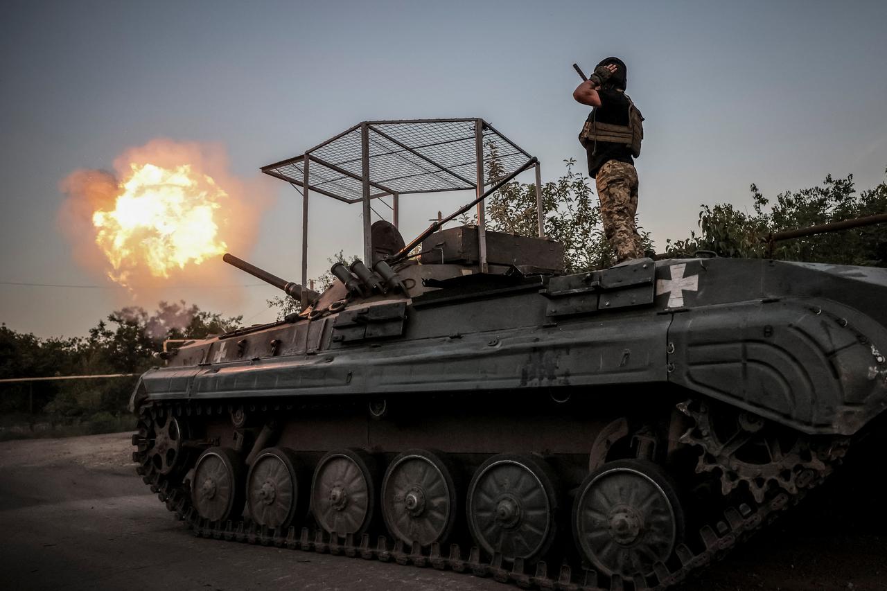 Ukrainian servicemen fire a BRM-1K infantry fighting vehicle towards Russian troops at a frontline near the town of Chasiv Yar