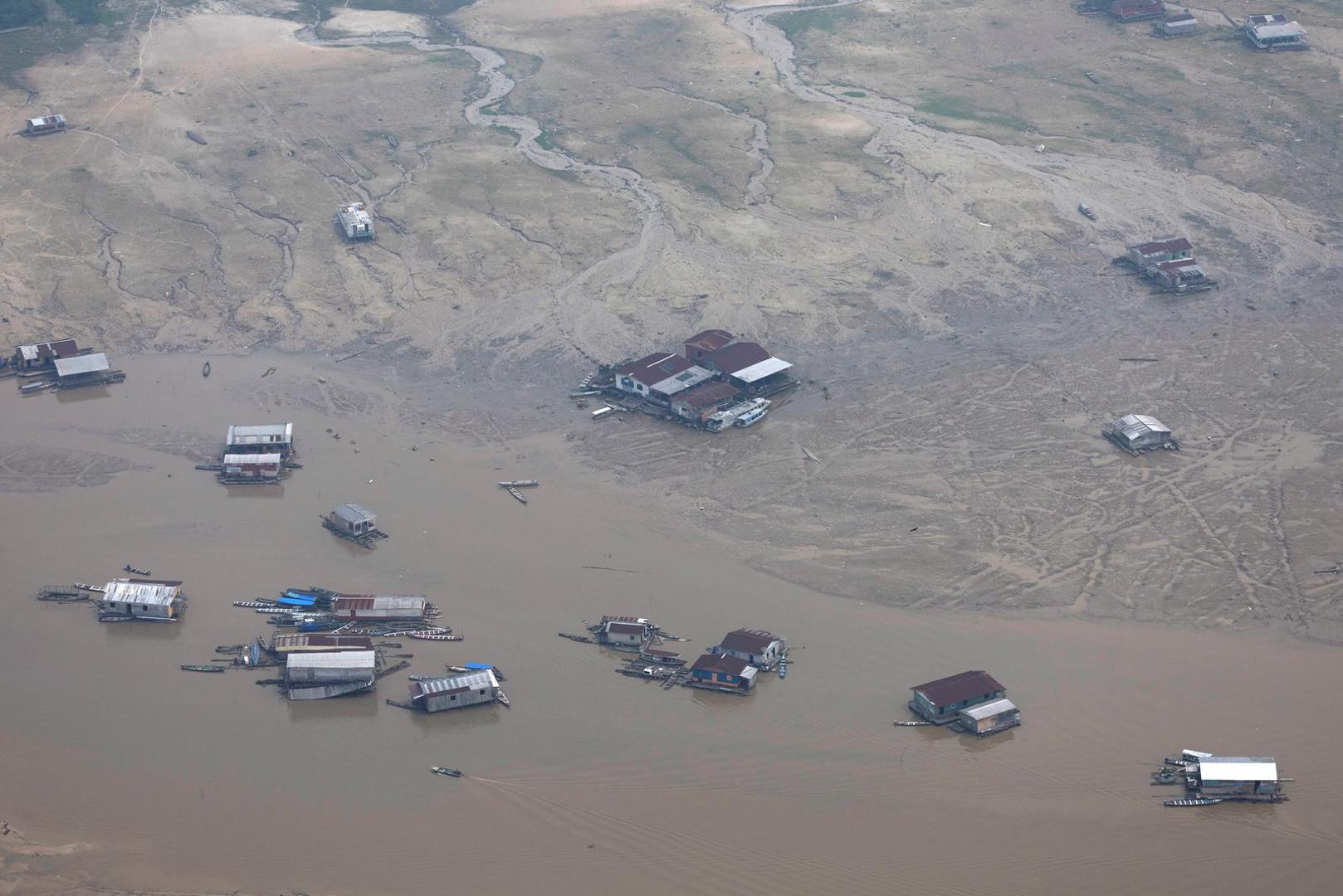 Stranded floating houses are seen at the Solimoes River, one of the largest tributaries of the Amazon River, during a Greenpeace flyover to inspect what the National Center for Monitoring and Early Warning of Natural Disasters (Cemaden) says is the most intense and widespread drought Brazil has experienced since records began in 1950, near Tefe, Amazonas state, Brazil September 17, 2024. REUTERS/Jorge Silva Photo: JORGE SILVA/REUTERS