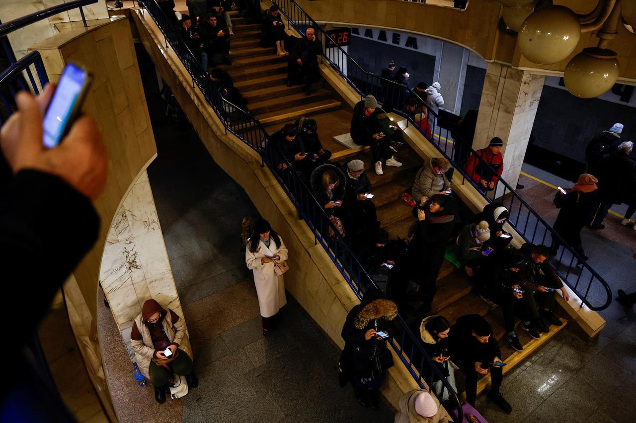 People take shelter during a Russian missile and drone attack, in Kyiv