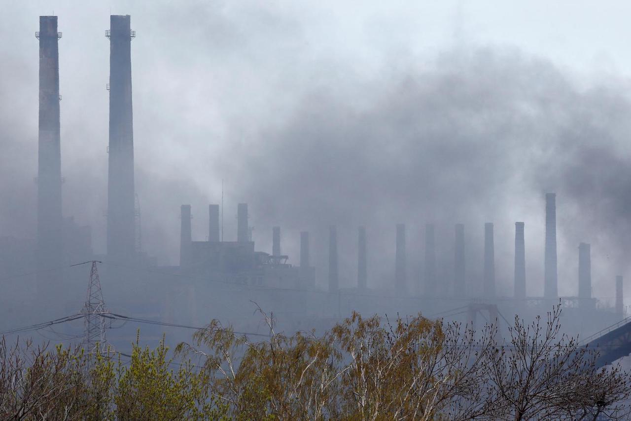 Smoke rises above a plant of Azovstal Iron and Steel Works in Mariupol