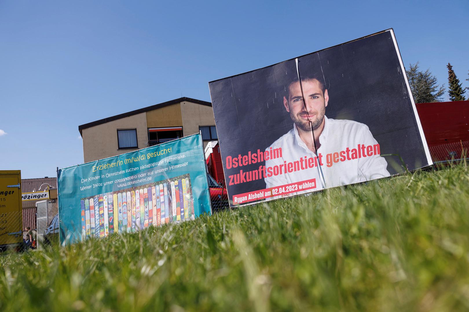 An election poster shows Syrian born Ryyan Alshebl, Ostelsheim mayor-designate, near Stuttgart in Ostelsheim, Germany, April 4, 2023. Alshebl fled from his hometown in Syria to Europe via the Mediterranean Sea in 2015 and came to the northern Black Forest. REUTERS/Lukas Barth Photo: Lukas Barth/REUTERS