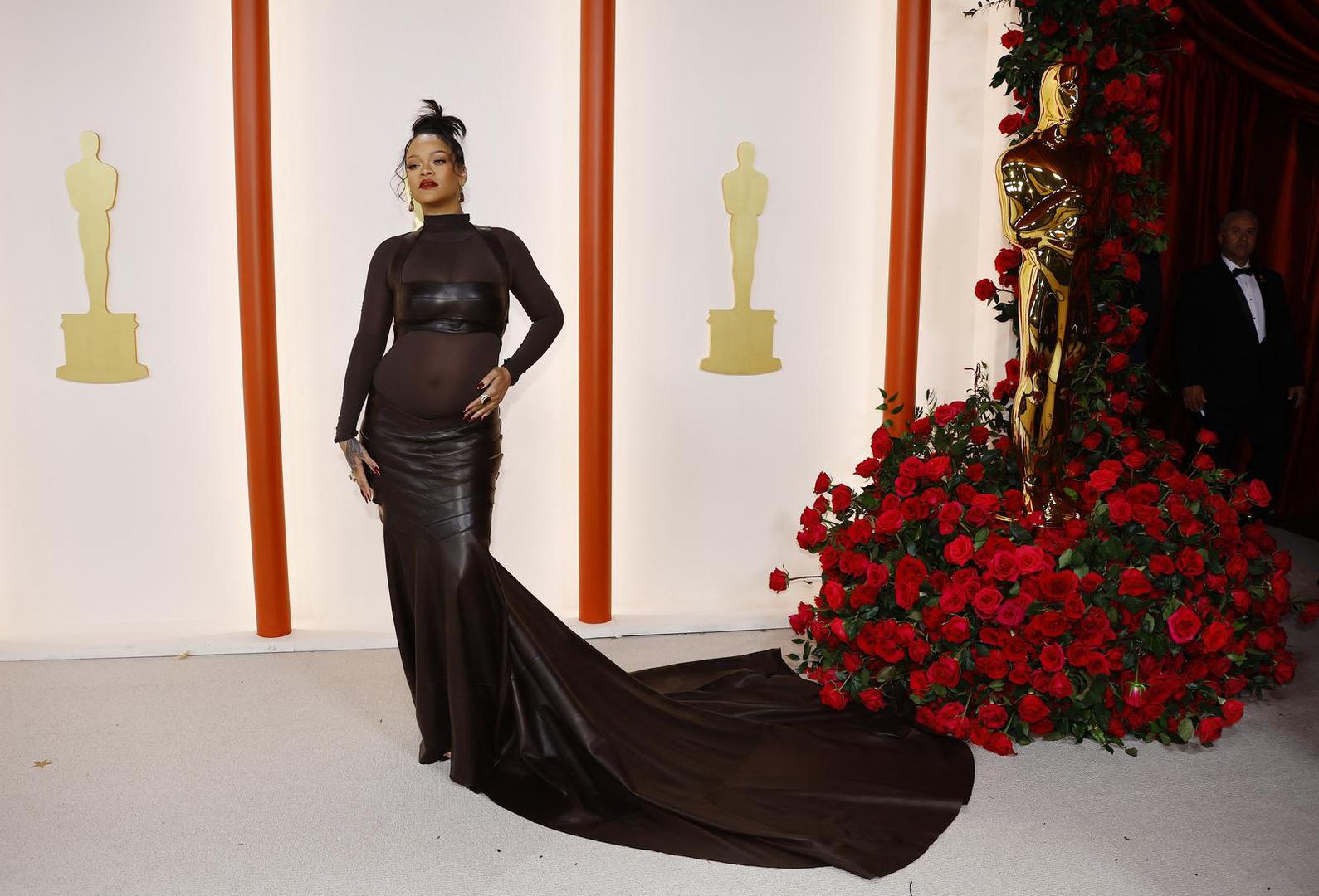 Rihanna poses on the champagne-colored red carpet during the Oscars arrivals at the 95th Academy Awards in Hollywood, Los Angeles, California, U.S., March 12, 2023. REUTERS/Eric Gaillard Photo: ERIC GAILLARD/REUTERS