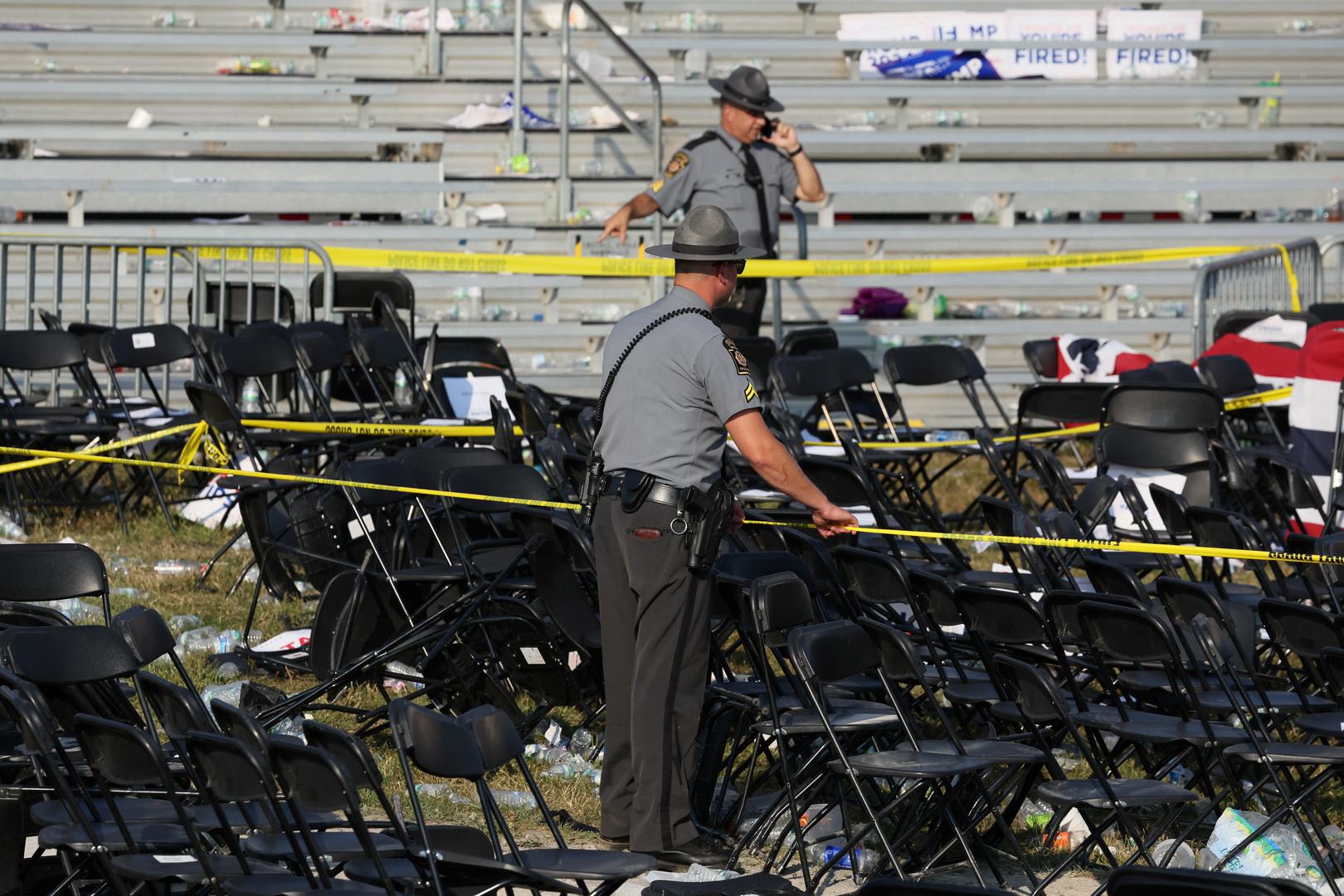 Security personnel put up barricade tape after multiple shots rung out at Republican presidential candidate and former U.S. President Donald Trump's campaign rally at the Butler Farm Show in Butler, Pennsylvania, U.S., July 13, 2024. REUTERS/Brendan McDermid Photo: BRENDAN MCDERMID/REUTERS