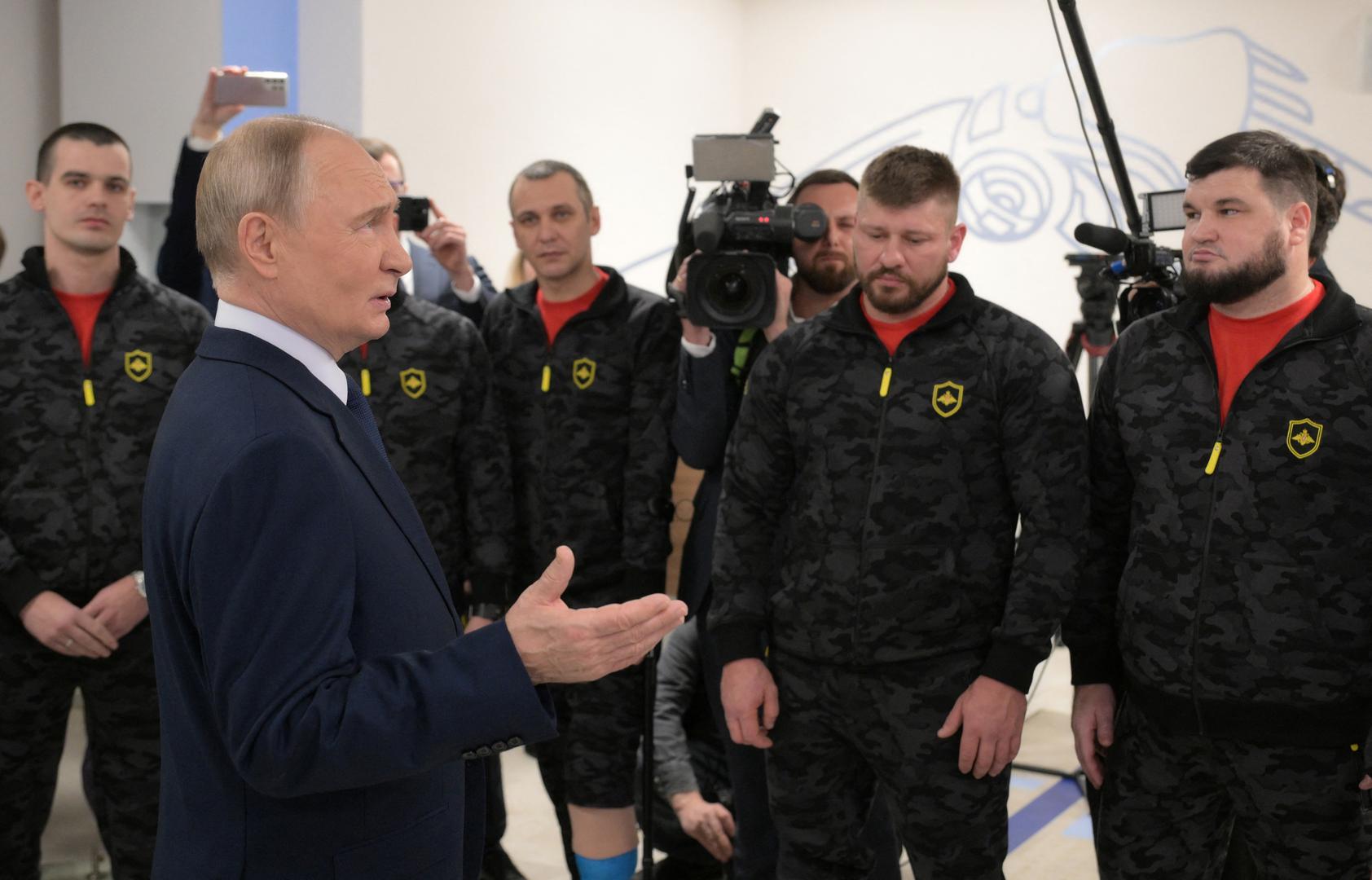 Russia's President Vladimir Putin meets with service members of the Russian armed forces, who were involved in the country's military campaign in Ukraine and currently undergo rehabilitation at the National medical research centre for traumatology and orthopedics, on International Day of Persons with Disabilities in Moscow, Russia, December 3, 2024. Sputnik/Vladimir Astapkovich/Pool via REUTERS ATTENTION EDITORS - THIS IMAGE WAS PROVIDED BY A THIRD PARTY. Photo: Vladimir Astapkovich/REUTERS