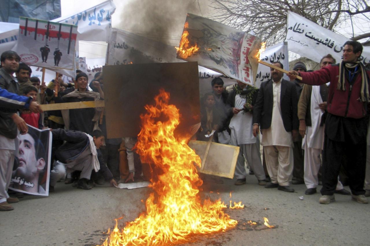 \'Afghans protesters burn posters of Iran\'s leaders during a demonstration in Jalalabad province January 29, 2011. Over 100 Afghans on Saturday took to the streets to protest against Iran\'s recent h