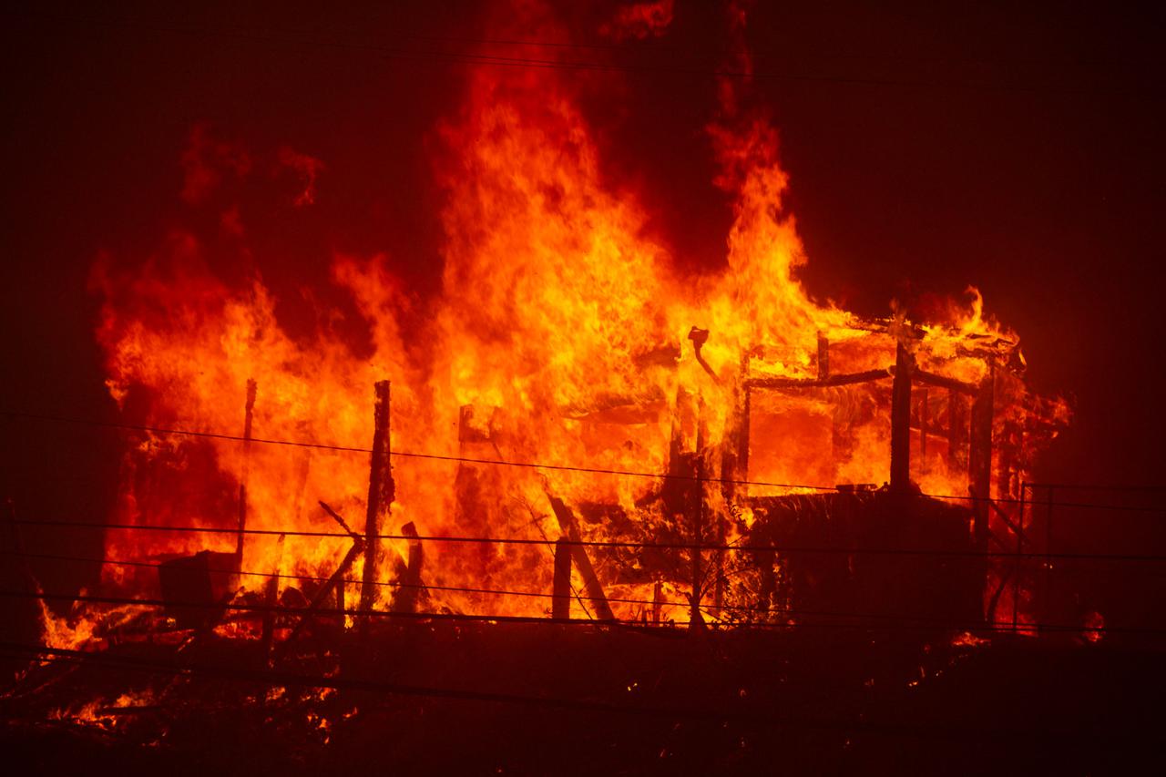 Palisades Fire burns during a windstorm on the west side of Los Angeles