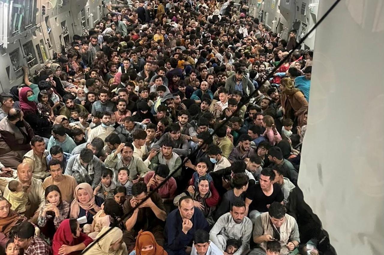 Evacuees crowd the interior of a U.S. Air Force C-17 Globemaster III transport aircraft departing Kabul