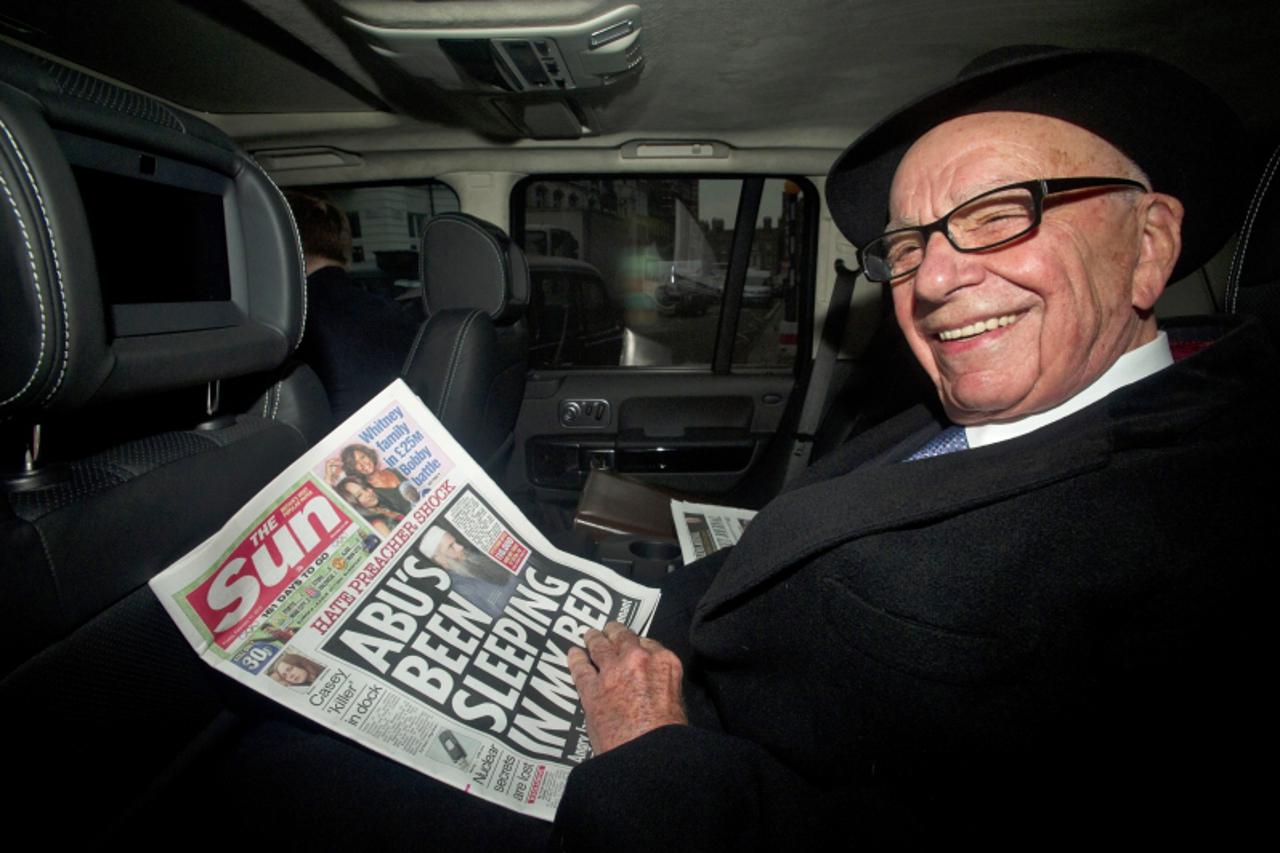 'epa03109873 News Corp Chairman, Rupert Murdoch  leaves his house in London, Britain, 17 February 2012. The 80-year-old tycoon is to address staff at the tabloid Sun newspaper, following the arrest of