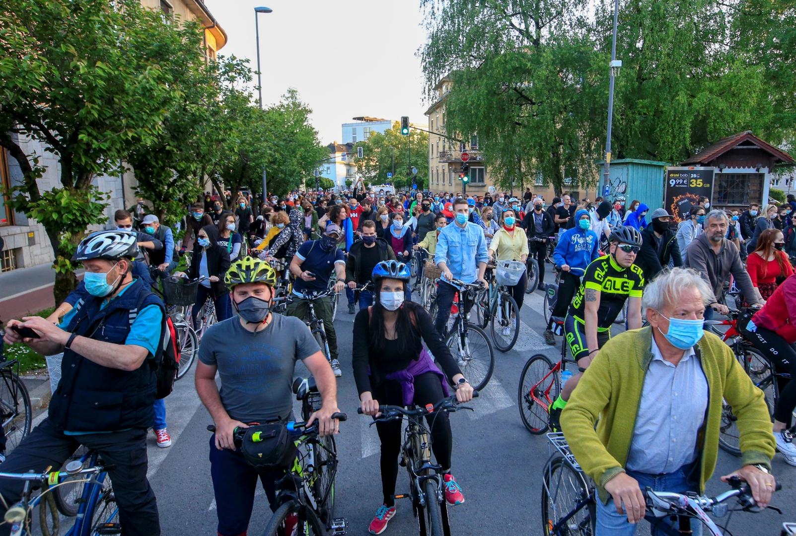 Protesters ride bicycles during an anti-government protest in Ljubljana Protesters wearing protective face masks ride bicycles during an anti-government protest, as the spread of the coronavirus disease (COVID-19) continues, in Ljubljana, Slovenia May 8, 2020. REUTERS/Borut Zivulovic BORUT ZIVULOVIC