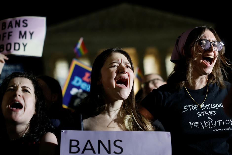 Protesters react outside the U.S. Supreme Court after the leak of a draft opinion preparing for a majority of the court to overturn the Roe v. Wade abortion rights decision in Washington