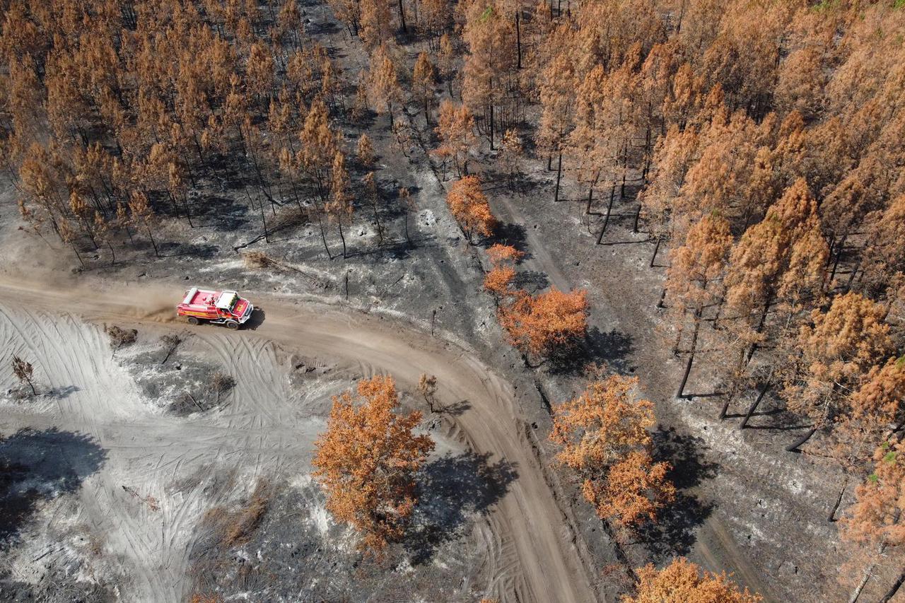 A view shows a firefighter truck amid fire in Hostens