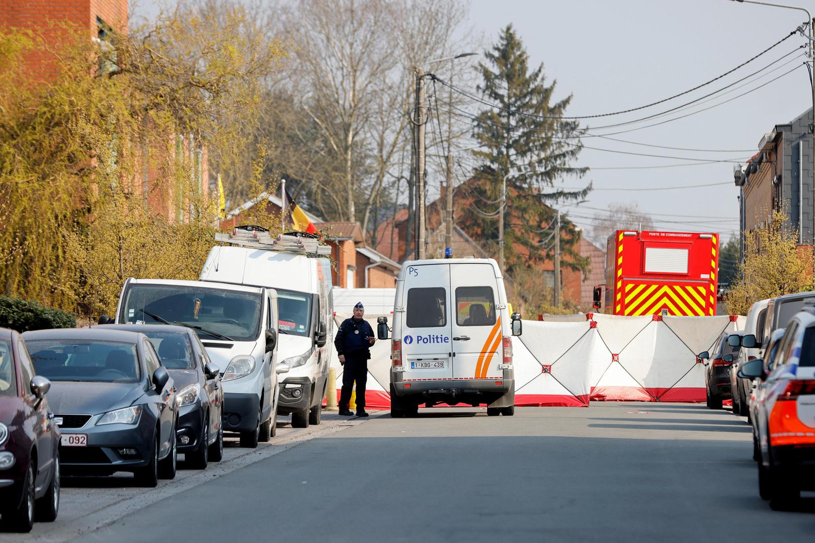 A police officer looks on at the site where a vehicle drove into a group of Belgian carnival performers who were preparing for a parade in the village of Strepy-Bracquegnies, Belgium March 20, 2022. REUTERS/Johanna Geron Photo: JOHANNA GERON/REUTERS