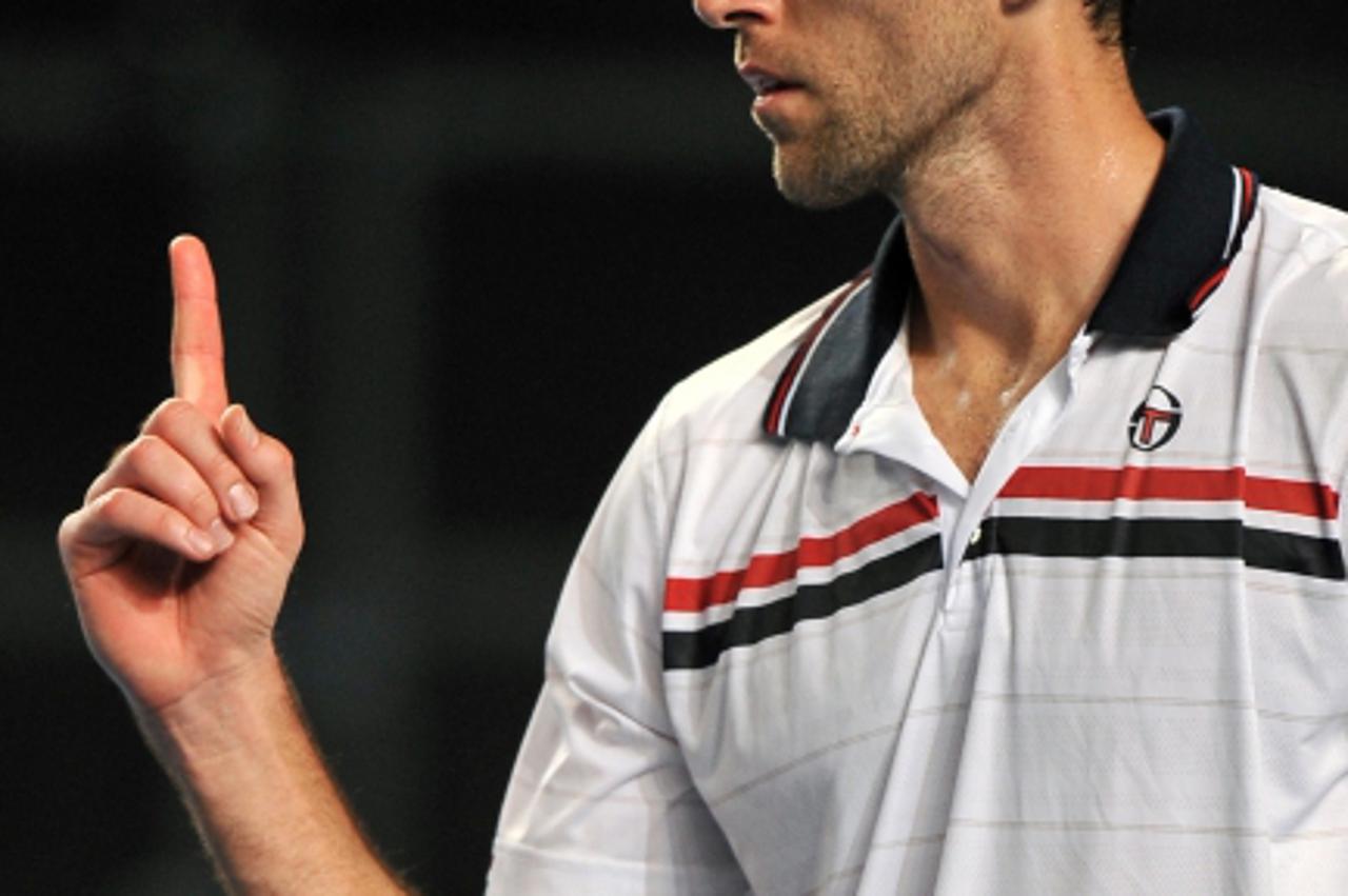 'Croatian tennis player Ivo Karlovic gestures during his men\'s singles match against compatriot Ivan Ljubicic on the fifth day of play at the Australian Open tennis tournament in Melbourne on January