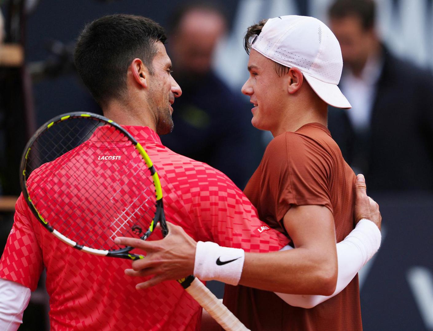 Tennis - Italian Open - Foro Italico, Rome, Italy - May 17, 2023 Denmark's Holger Rune with Serbia's Novak Djokovic after winning his quarter final match REUTERS/Aleksandra Szmigiel Photo: ALEKSANDRA SZMIGIEL/REUTERS