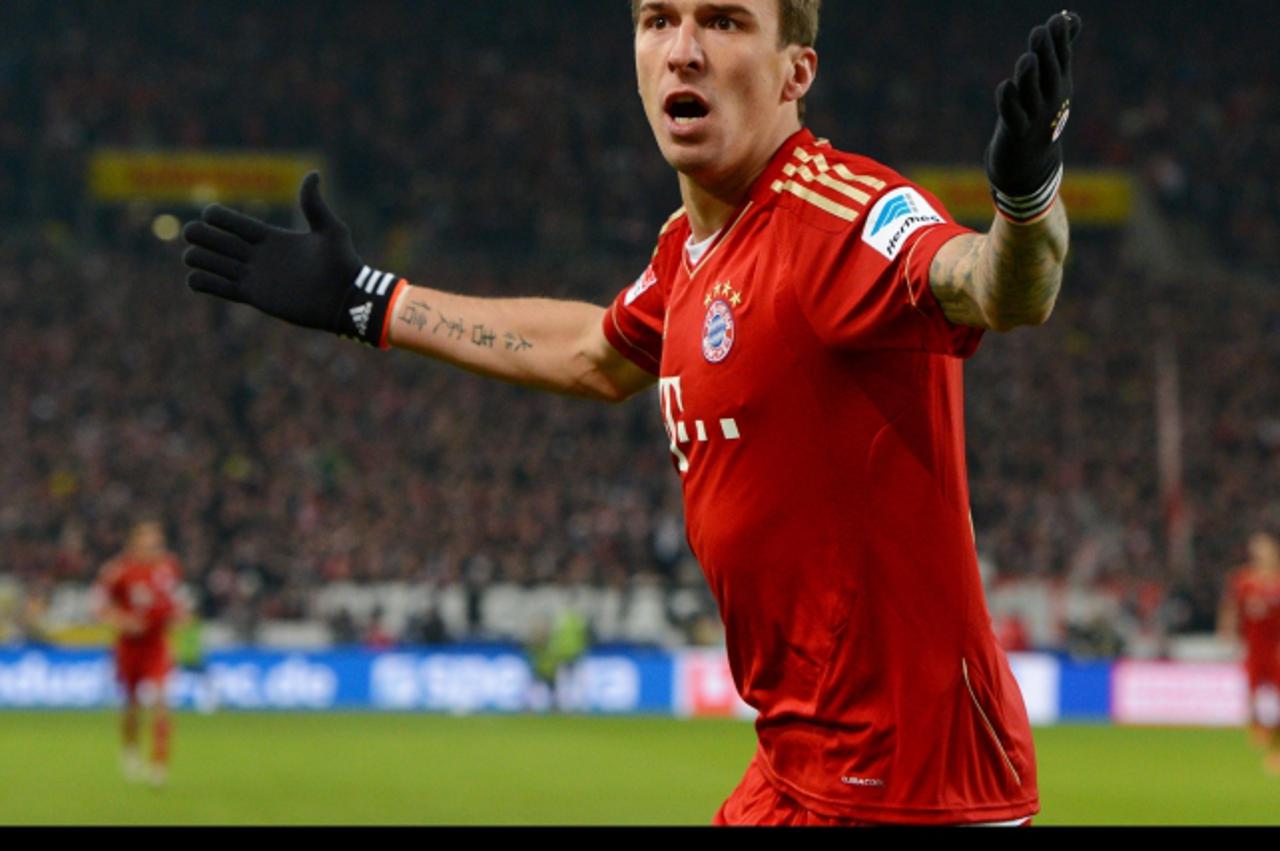 'Munich\'s Mario Mandzukic celebrates his 1-0 goal during the German Bundesliga match between VfB Stuttgart and FC Bayern Munich at Mercedes-Benz Arena in Stuttgart, Germany, 27 January 2013. Photo: B