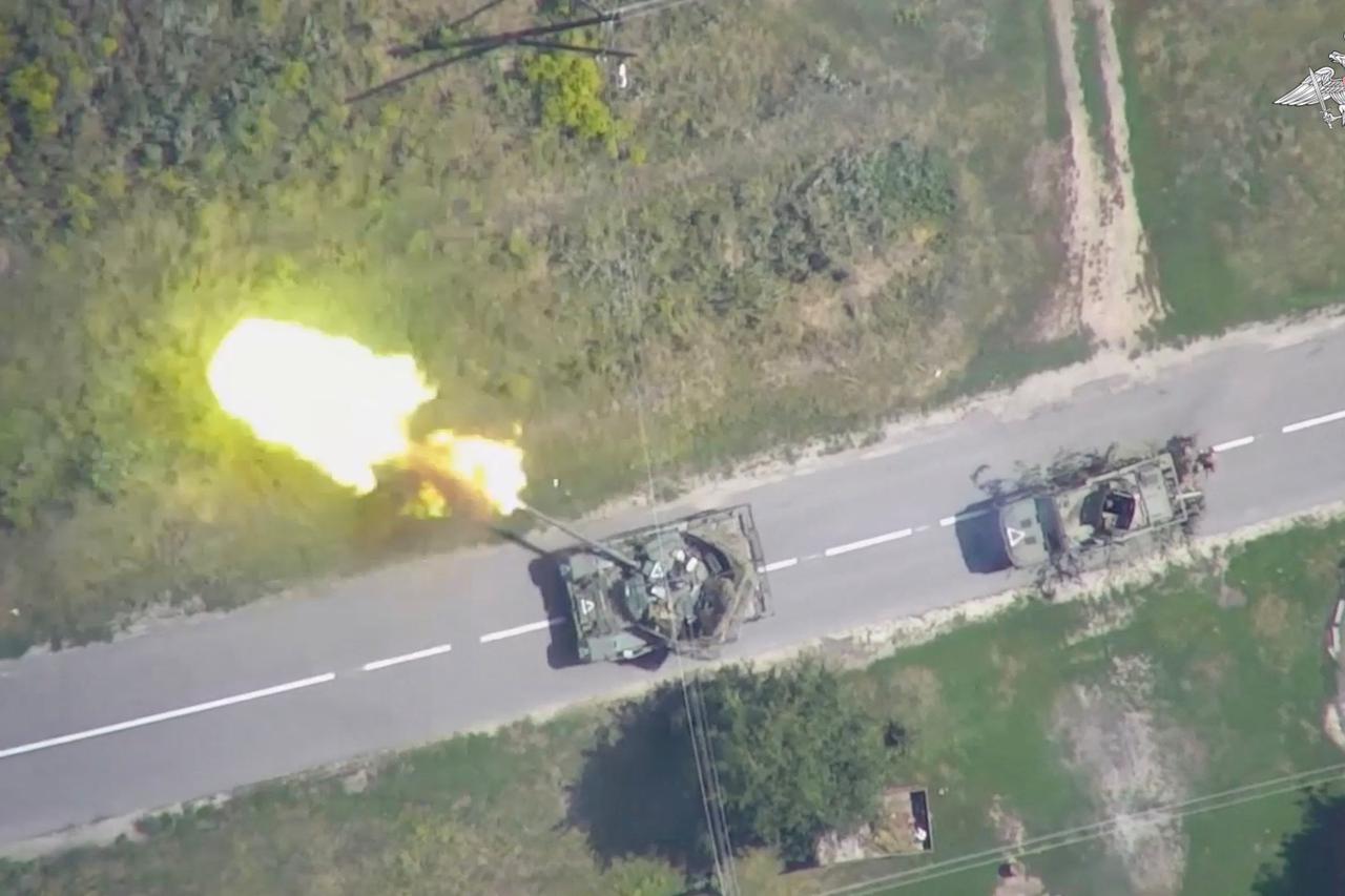 An aerial view shows what is said to be a firing Ukrainian tank in Kursk region