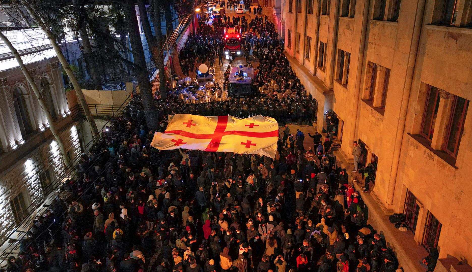 Protesters gather in front of police officers, who block the way during a rally against the "foreign agents" law in Tbilisi, Georgia, March 7, 2023. REUTERS/Zurab Javakhadze Photo: ZURAB JAVAKHADZE/REUTERS