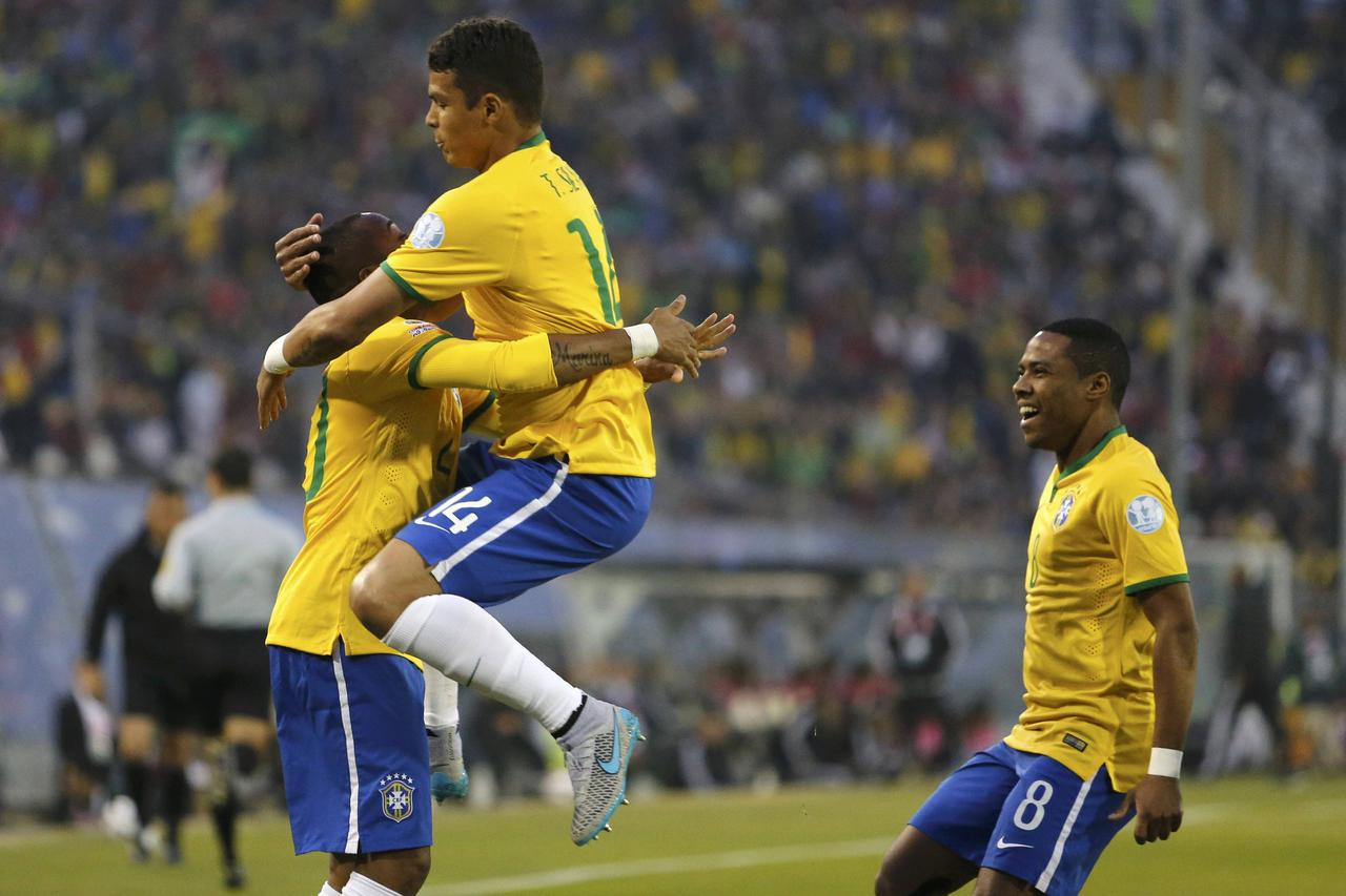 Brazil's Thiago Silva (14) celebrates his goal against Venezuela with Robinho during their first round Copa America 2015 soccer match at Estadio Monumental David Arellano in Santiago, Chile, June 21, 2015. REUTERS/Andres Stapff