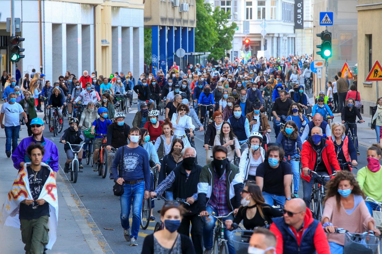 Protesters ride bicycles during an anti-government protest in Ljubljana Protesters wearing protective face masks ride bicycles during an anti-government protest, as the spread of the coronavirus disease (COVID-19) continues, in Ljubljana, Slovenia May 8, 2020. REUTERS/Borut Zivulovic BORUT ZIVULOVIC