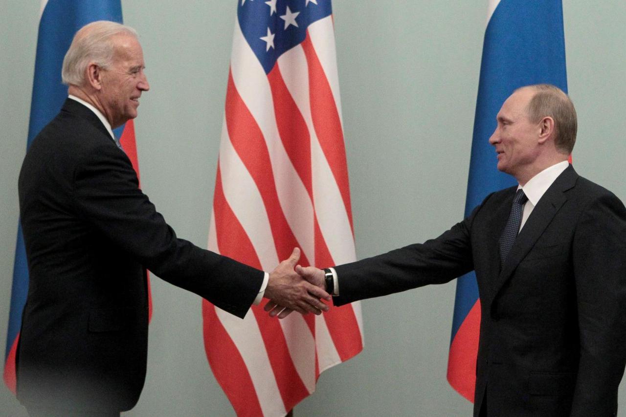 FILE PHOTO: Russian Prime Minister Putin shakes hands with U.S. Vice President Biden during their meeting in Moscow