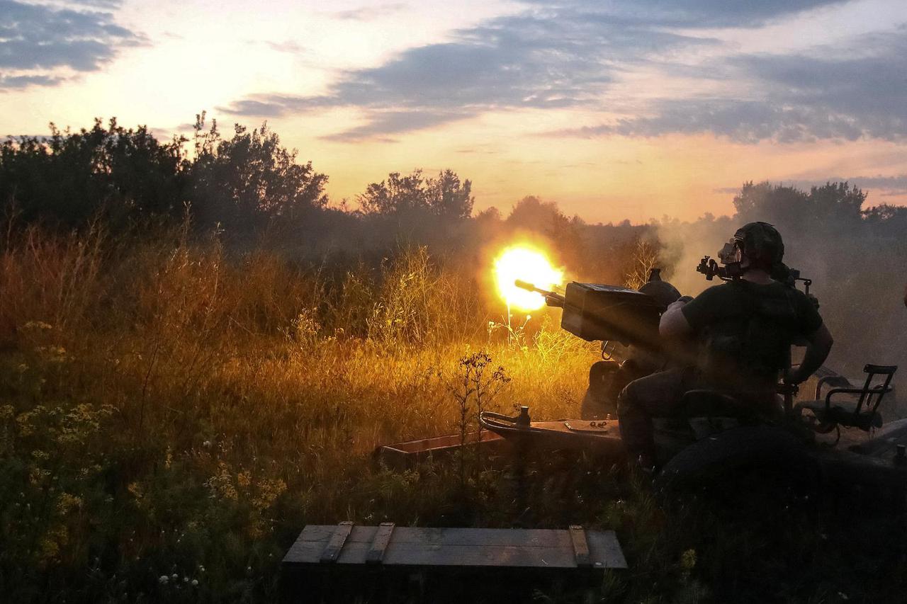 Ukrainian serviceman fires with a ZU-23-2 anti-aircraft cannon at position near a front line in Kharkiv region