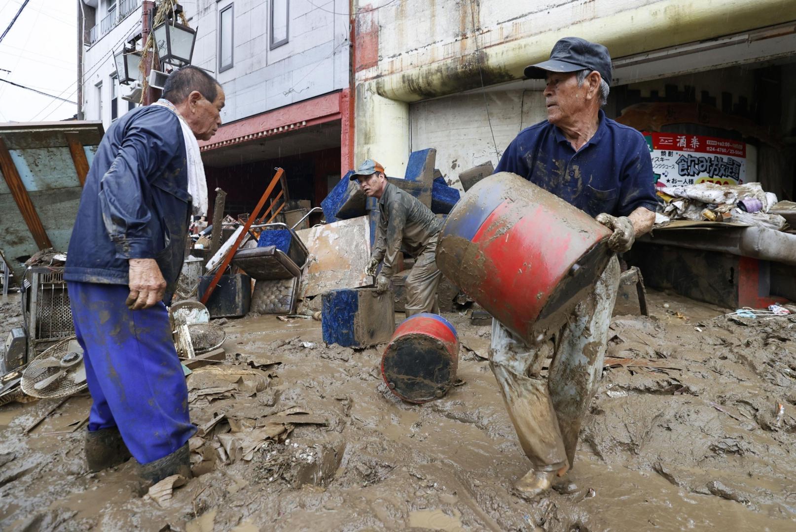 People engage in clean up in the flood-ravaged city of Hitoyoshi in Kumamoto Prefecture, southwestern Japan, on July 7, 2020, after deadly torrential rain. (Kyodo)
==Kyodo
 Photo via Newscom Newscom/PIXSELL