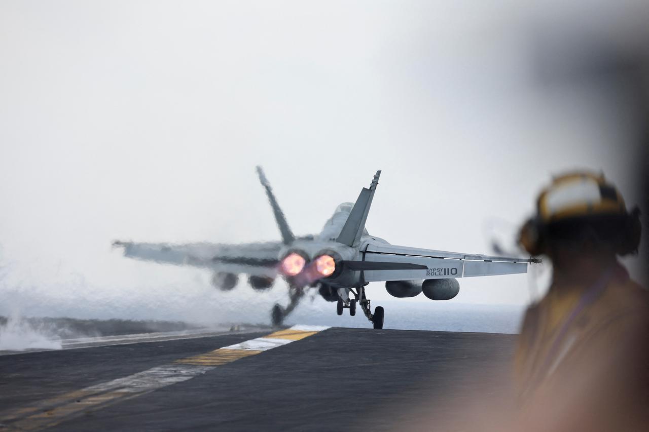 A F/A-18E Super Hornet fighter jet is catapulted off the flight deck of the USS Dwight D. Eisenhower (CVN 69) aircraft carrier in Southern Red Sea, Middle East