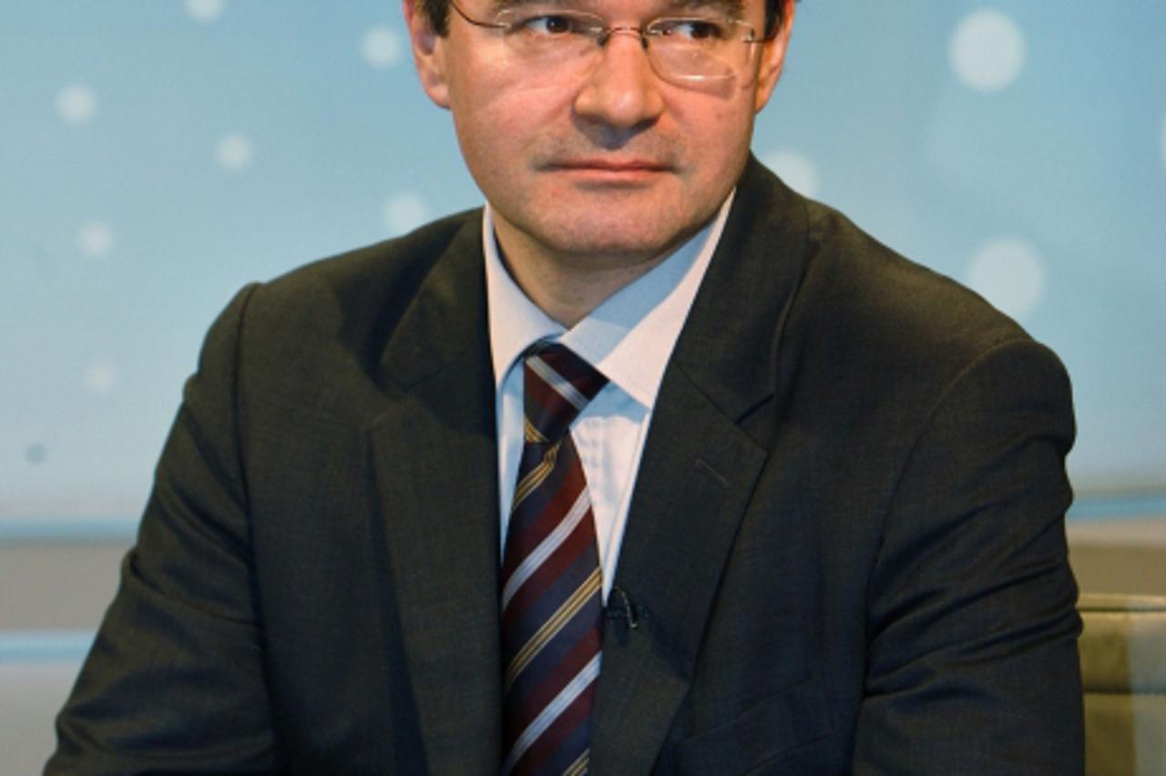 'Greek Finance Minister George Papaconstantinou prepares for a Reuters Insider television interview during a visit to the Reuters newsroom in Canary Wharf, London December 16, 2009.  Papaconstantinou 