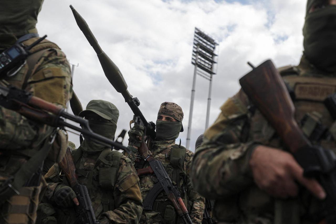 Khaled Brigade, a part of Hay'at Tahrir al-Sham (HTS), hold a military parade, in Damascus