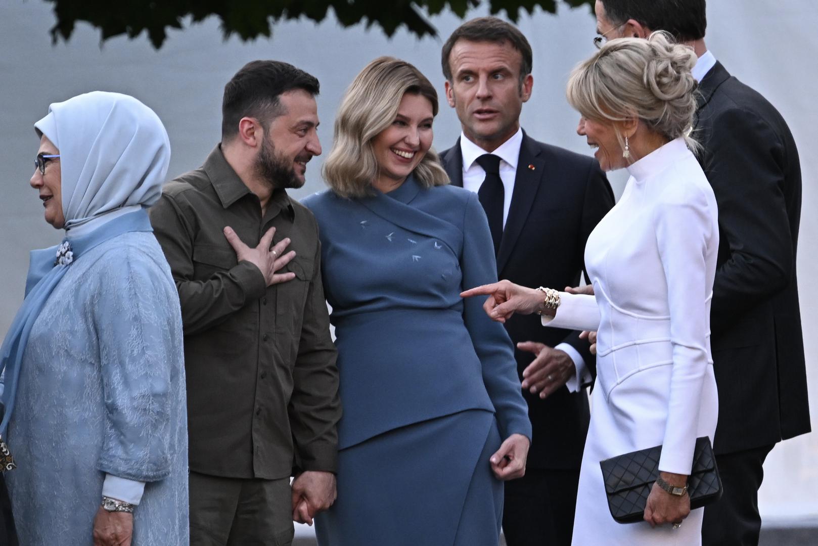 (2nd left to right) Ukrainian President Volodymyr Zelensky (centre left) and his wife Olena Zelenska talk with French President Emmanuel Macron and his wife Brigitte Macron as they arrive for the social dinner during the Nato summit in Vilnius, Lithuania. Picture date: Tuesday July 11, 2023. Photo: PAUL ELLIS/PRESS ASSOCIATION