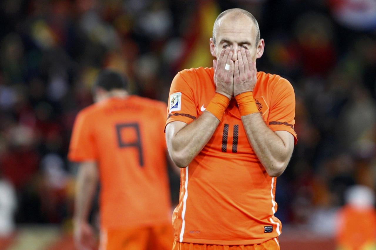 'Netherlands\' Arjen Robben reacts at the end of their 2010 World Cup final soccer match against Spain at Soccer City stadium in Johannesburg July 11, 2010. REUTERS/Michael Kooren (SOUTH AFRICA  - Tag