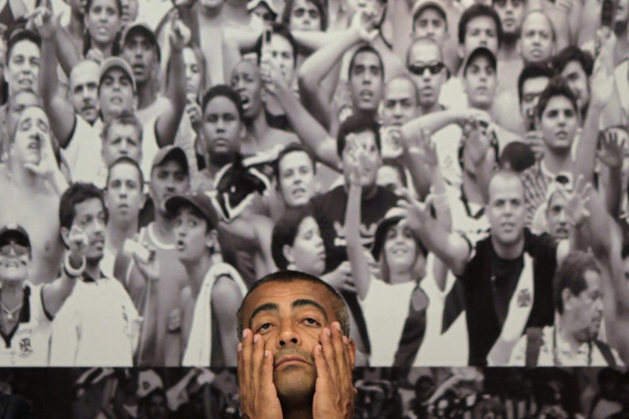 'Brazil\'s Congressman and former soccer star Romario reacts during a visit to the Maracana Stadium renovations for the 2014 World Cup in Rio de Janeiro October 10, 2011. REUTERS/Ricardo Moraes (BRAZI