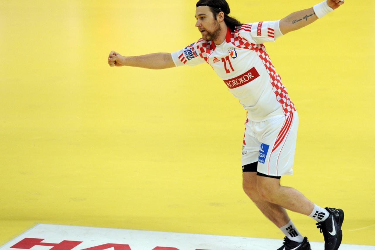 'Croatia\'s Ivan Cupic celebrates after scoring a goal during the men\'s EHF Euro 2012 Handball Championship semifinal match Serbia vs Croatia on January 27, 2012 at the Beogradska Arena in Belgrade. 