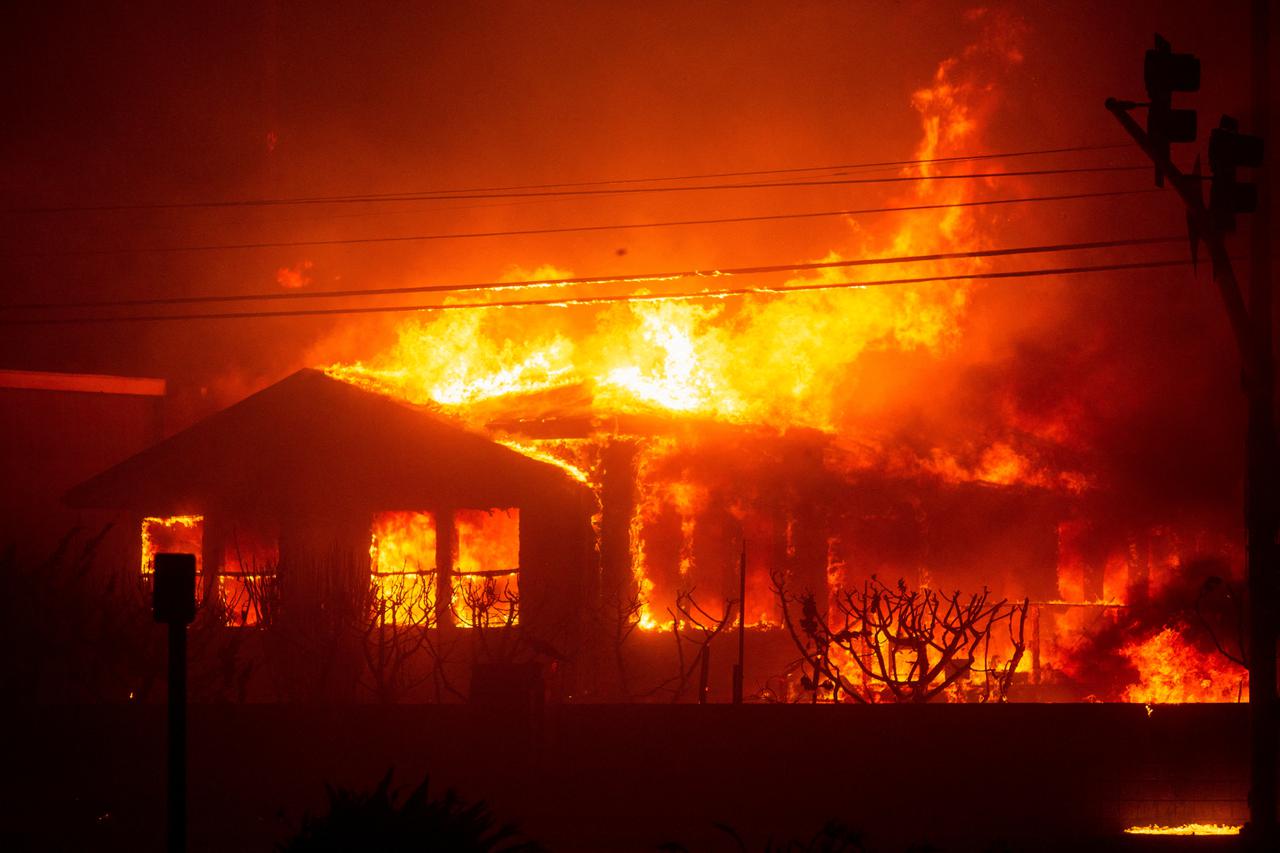 FILE PHOTO: Palisades Fire burns during a windstorm on the west side of Los Angeles