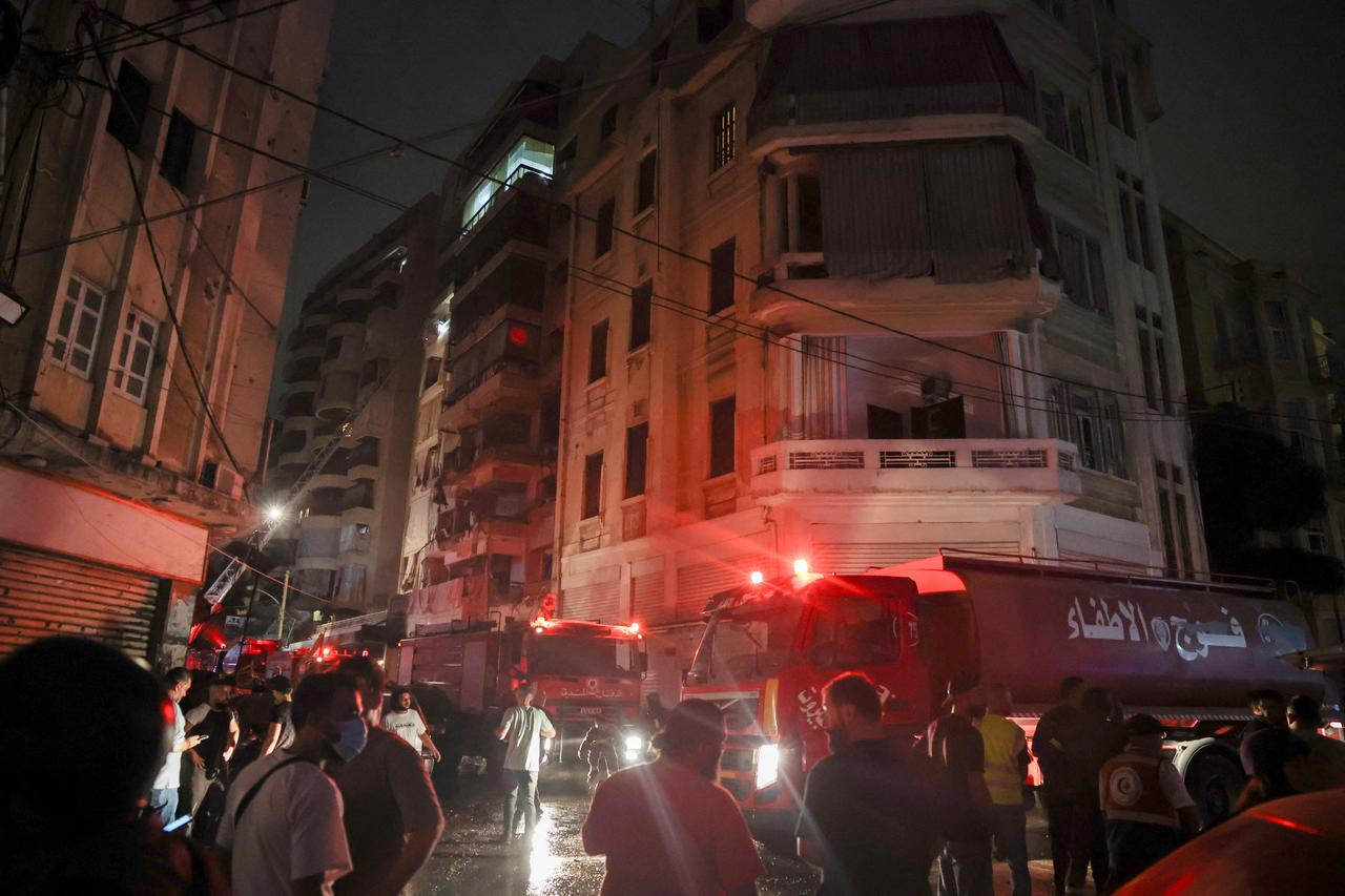 Rescue vehicles attend to the site of an Israeli air strike, in Beirut