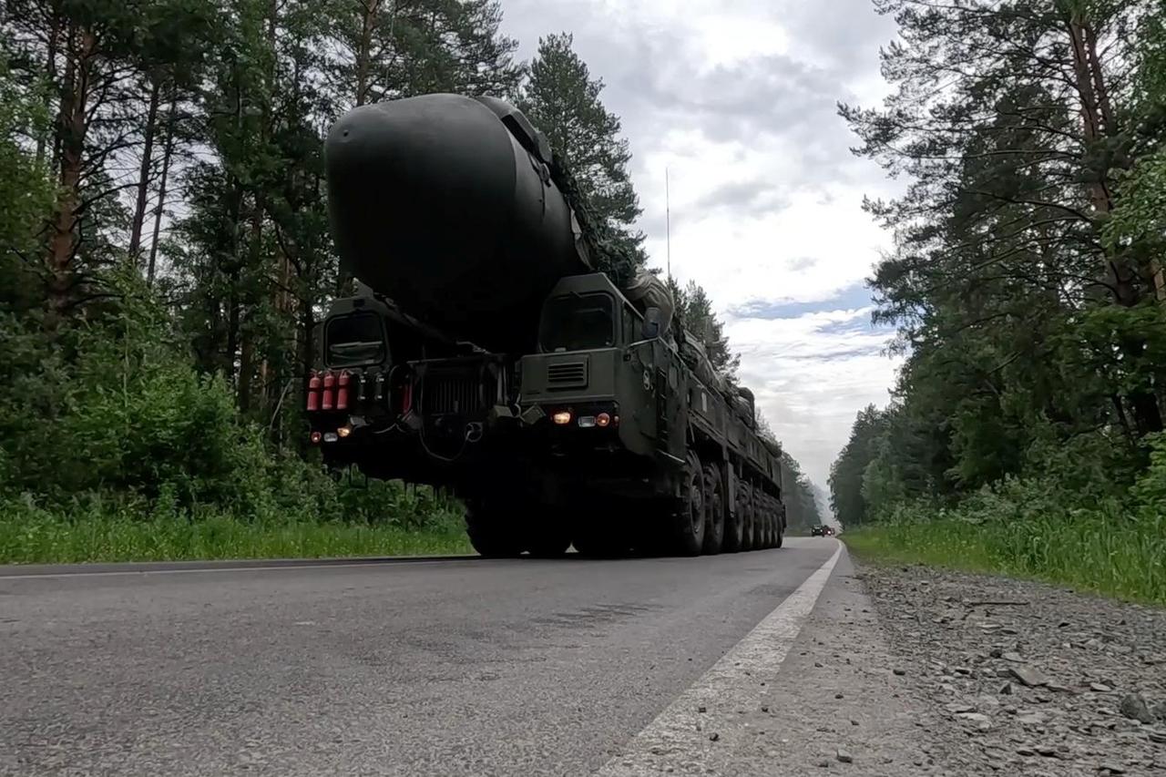 Ukrainian servicemen fire a self-propelled howitzer towards Russian troops at a frontline near the town of Chasiv Yar