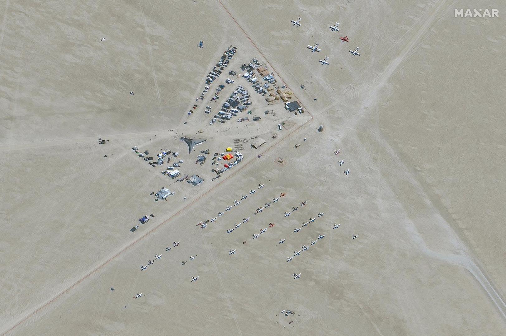 A satellite view shows an air park during the 2023 Burning Man festival, in Black Rock Desert, Nevada, U.S., August 28, 2023.  Maxar Technologies/Handout via REUTERS THIS IMAGE HAS BEEN SUPPLIED BY A THIRD PARTY. NO RESALES. NO ARCHIVES. MANDATORY CREDIT. DO NOT OBSCURE LOGO. Photo: MAXAR TECHNOLOGIES/REUTERS