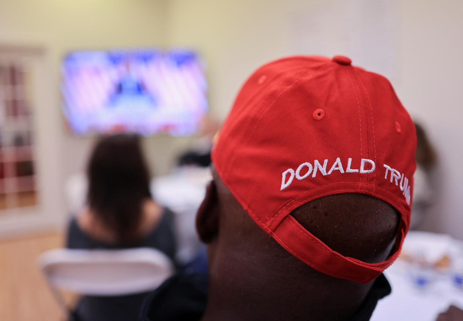 A person watches Republican presidential candidate and former U.S. President Donald Trump speak on a TV screen at a watch party event to mark the Super Tuesday primary elections, in Long Beach, California, U.S., March 5, 2024. REUTERS/David Swanson Photo: DAVID SWANSON/REUTERS