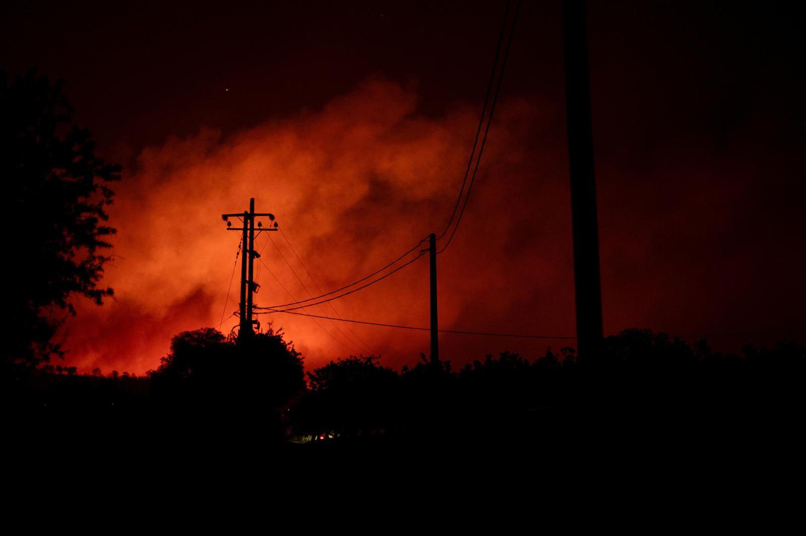 Smoke rises as a wildfire burns in the village of Varnavas, near Athens, Greece, August 11, 2024. REUTERS/Hilary Swift Photo: Hilary Swift/REUTERS