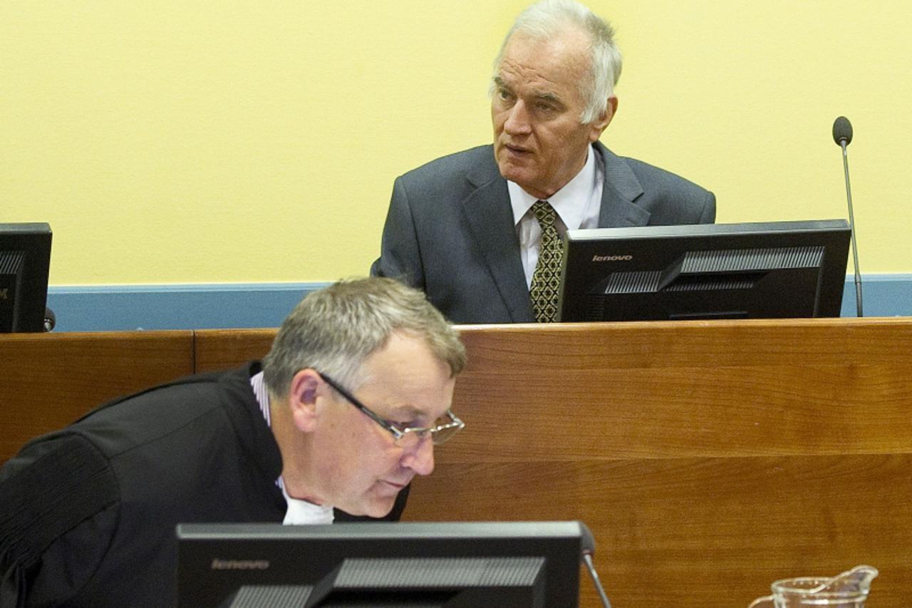 'Former Bosnian Serb army commander Ratko Mladic (rear) attends his trial at the International Criminal Tribunal for the former Yugoslavia (ICTY) at The Hague May 16, 2012. Mladic, 70, appeared on Wed