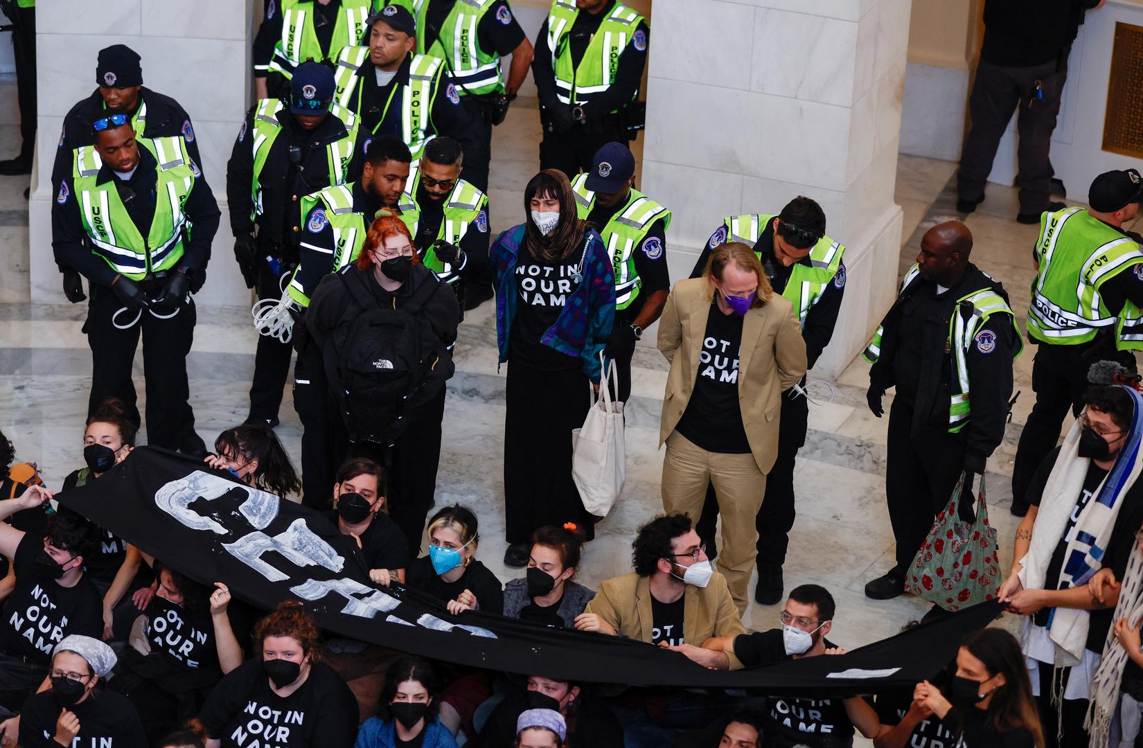 Demonstrators involved in a civil disobedience action organized by a group called "Jewish Voice for Peace" are detained by U.S. Capitol police officers during a protest calling for a cease fire in Gaza while occupying the rotunda of the Cannon House office building on Capitol Hill in Washington, U.S., October 18, 2023. REUTERS/Jonathan Ernst Photo: JONATHAN ERNST/REUTERS