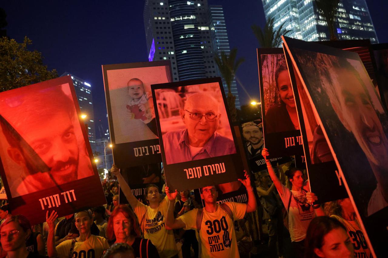 Supporters of the hostages being held in Gaza mark 300 days since the deadly October 7 attack, in Tel Aviv