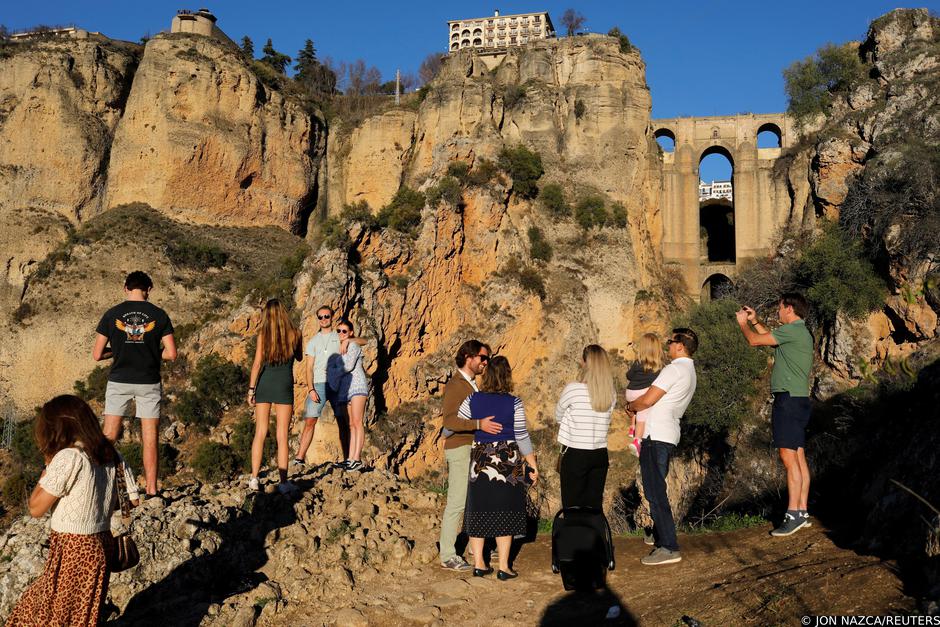 Dutch tourists gather without masks in front of the Puente Nuevo (New Bridge) in Ronda