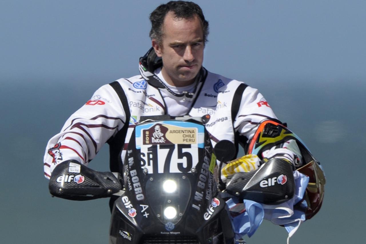 \'Argentina\'s Jorge Martinez Boero rides his Beta on the podium during the symbolic start of the 2012 Dakar Rally in Mar del Plata, some 400 Km south of Buenos Aires, on December 31, 2011. Martinez B