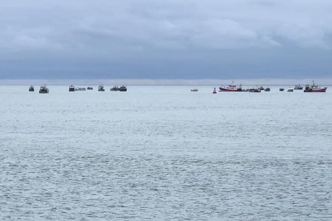 Boats are seen in the only channel that allows access to the harbour, in St Helier