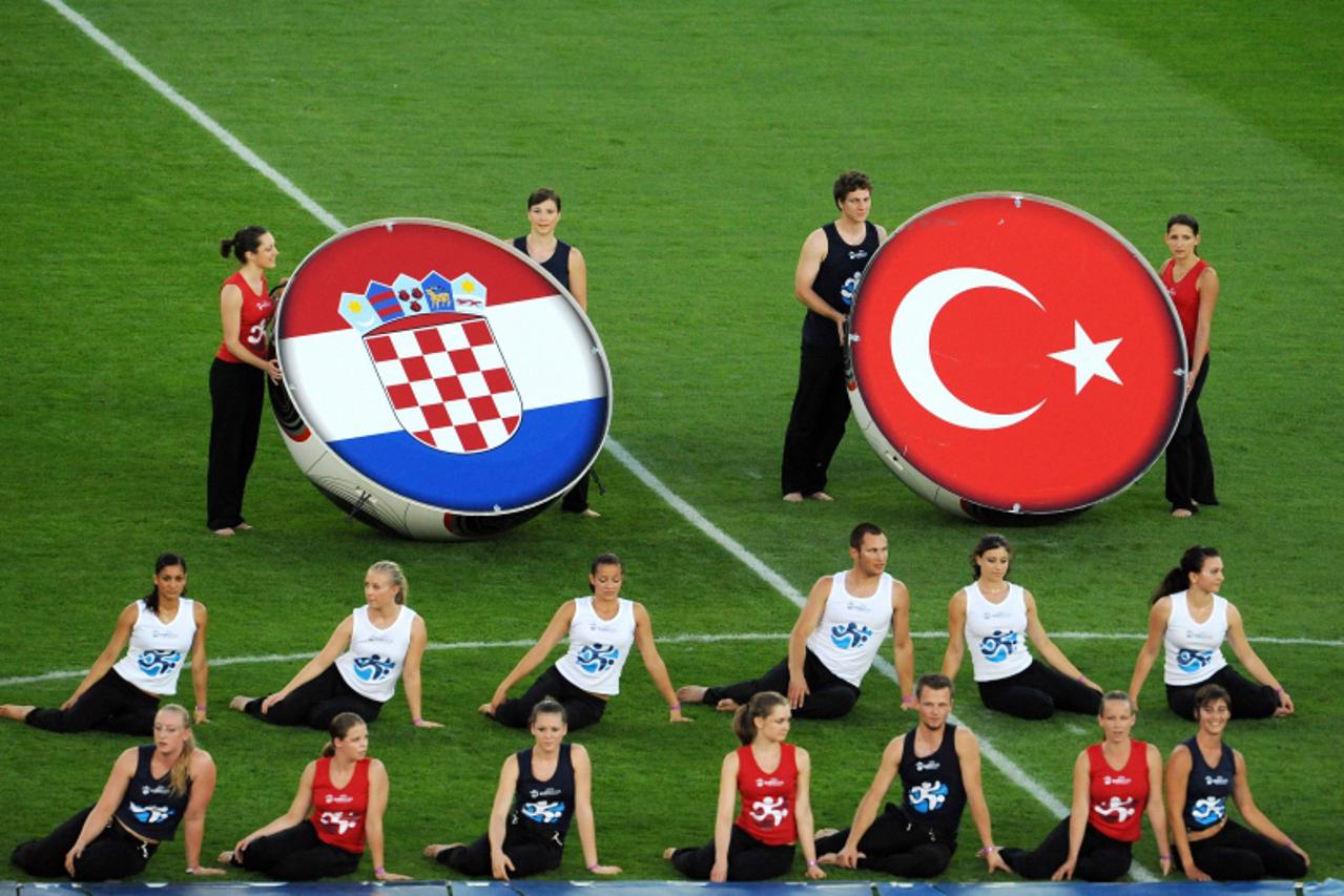 'Dancers present the Croatian (L) and Turkish emblems before the Euro 2008 Championships quarter-final football match Croatia vs. Turkey on June 20, 2008 at Ernst Happel Stadium in Vienna. AFP PHOTO /