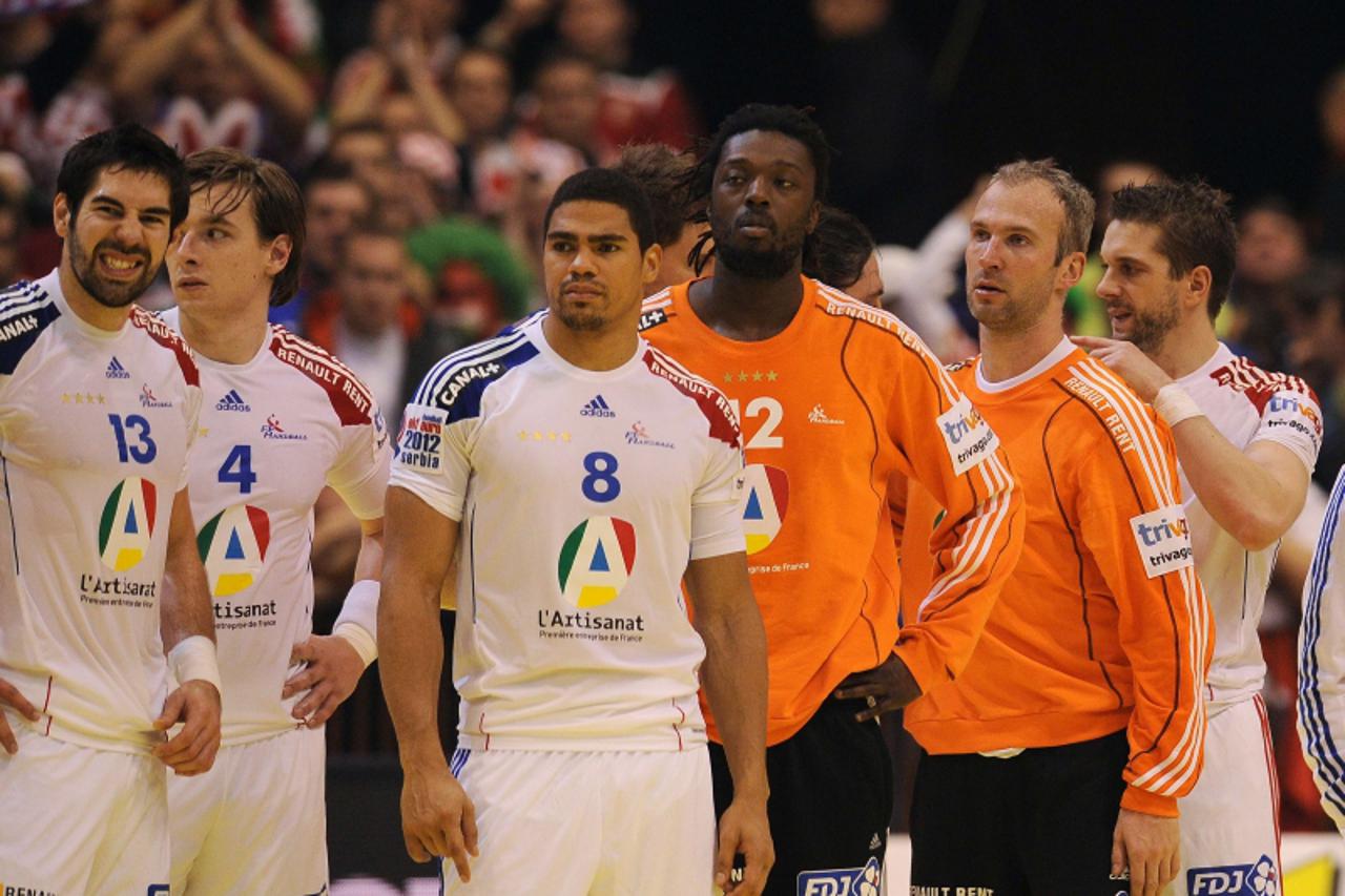 'French Nikola Karabatic (L), Xavier Barachet (2nd L), Daniel Narcisse (3rd L), Daouda Karaboue (3rd R), and Thierry Omeyer (2nd R) leave the playing field at the end of the men\'s EHF Euro 2012 Handb