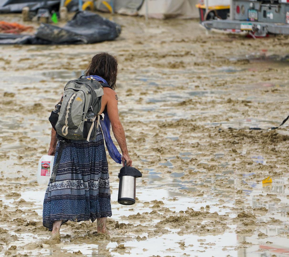 A Burning Man participant makes their way through the mud in Black Rock City, in the Nevada desert, after a rainstorm turned the site into mud September 2, 2023.  Trevor Hughes/USA TODAY NETWORK via REUTERS  NO RESALES. NO ARCHIVES. Photo: USA TODAY/REUTERS