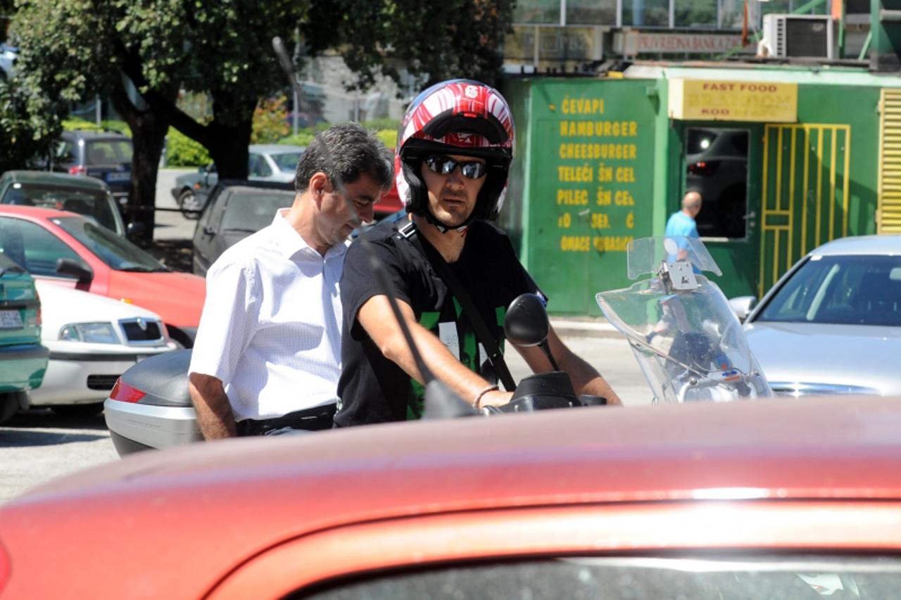 '26.07.2010.,split - kosarkaski klub split dino rada odlazi iz kluba a na njegovo mjesto dolazi ante naletilic dino je dosao na motoru sa petrom skovrljom koji nije nosio kacigu Photo: Nino Strmotic/P